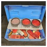 Various red & White Safety Reflectors in Blue Box