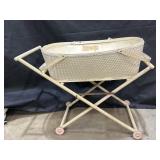 Wooden and wicker baby doll stroller on wheels