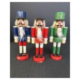 3 - 10in wood nutcrackers.  Red one missing hat