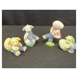4 Mary Moo cow figurines posing w/Easter eggs