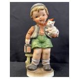 Porcelain figurine of boy holding a cat & lantern