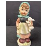 Porcelain figurine of a girl holding a bunny