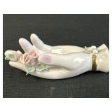 Porcelain trinket dish of a ladyï¿½s hand & flowers