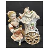 Porcelain Victorian girl with flower carriage vase