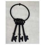 Decorative cast iron jail keys on black metal ring