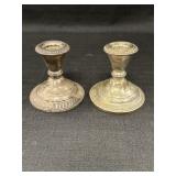 Pair of Sterling candlestick holders, weighted &