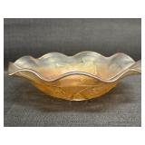 Marigold Carnival Glass bowl w/ a ruffled edge
