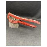 Vintage Red Handled Metal Potato Ricer