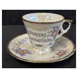 Iridescent porcelain 'anniversary' teacup & saucer