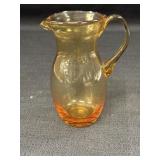Hand blown amber glass 5in pitcher w/applied