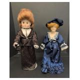 (2) Porcelain Dolls w/ Brown dress & Blue dress