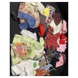 Variety of different sized doll clothes