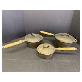 Set of 3 heavy cast iron sauce pans w/lids &