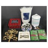 Variety of Christmas decor - tins, fake snow,