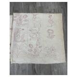 2 hand stitched quilt, one has embroidery