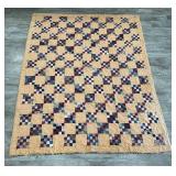 Hand stitched tie quilt
