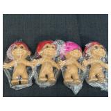 4 Russ 5in troll dolls, 3 w/red hair & 1 w/pink,