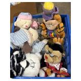 Variety of plush toys, mostly bears, in plastic