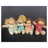 (4) Cabbage Patch Kids Dolls variety of models.