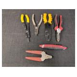 Wire strippers, snap ring pliers, live wire tester