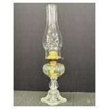 Clear pressed glass oil lamp w/ornate bullseye