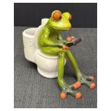 Comical frog on toilet with phone figurine,