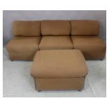 Contemporary brown upholstered couch and ottoman