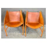 Pair of orange painted metal & leather chairs