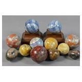 Group of 12 marble and ceramic balls and eggs