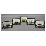 5 Pairs of silver plated berry spoons in cases