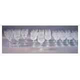 Two sets of crystal wine glasses