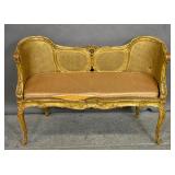 Louis XV style gold painted caned settee
