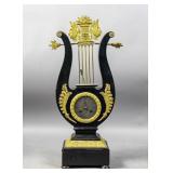 Empire style gilt-metal mounted ebonized clock