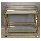 Glass & brass bar cart on wheels