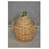 Large Vintage green glass wine jug with basket