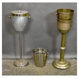 2 Champagne buckets on stands;