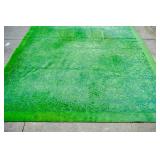Machine made green floral rug