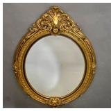 Rococo style gilt framed oval mirror