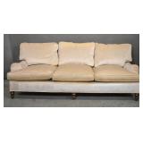 Cream upholstered sofa