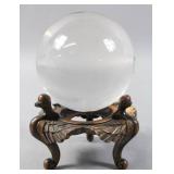 Crystal ball on carved stand