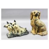 Two cast iron dog form door stops
