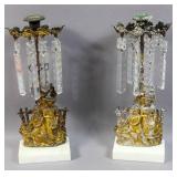 Pair of figural brass candle holders