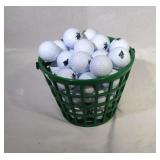 bucket of golf balls with NFL team logos