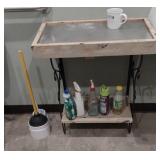 bathroom 2-tier shelf with a few cleaning supplies
