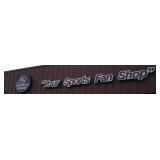 "Your Sports Fan Shop" signs and circular outdoor
