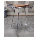 Circular apparel tree with wood triangle center