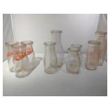 9 Glass Milk Jars of Various Sizes