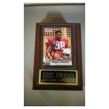 autographed Eric Swann rookie card on plaque
