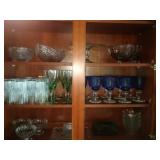contents of upper left cupboard - cut glass, cake
