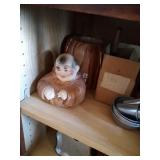 contents of lower left cupboard - Monk cookie jar,